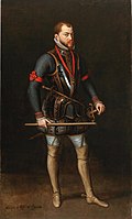 Portrait of King Félipe I of Casilló, 1551, portraying a standing man in his middle years with dark orange hair and beard and a stern expression. He is wearing brown hose and red-and-gold decorated black armor in the style of the 1500s. He holds a golden rod across his legs and the background is dark.