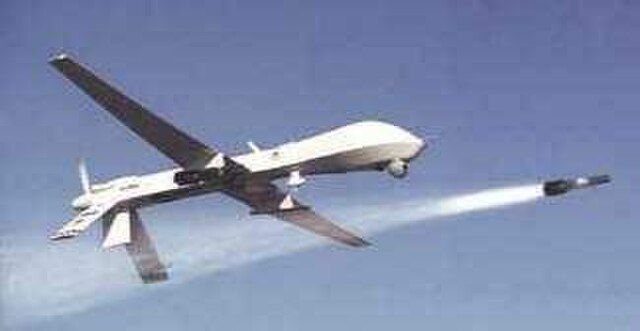 A Predator drone firing a Hellfire missile