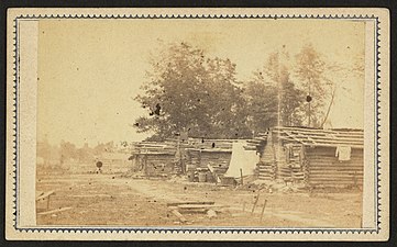 Garrison Housing – Locally improvised Confederate structures that provided housing for the Port Hudson garrison, 1863–1864, Library of Congress collection.