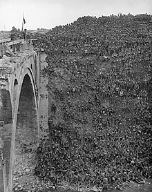 Brigadier General J V Campbell addressing troops of the 137th Brigade (46th Division) from the Riqueval Bridge over the St Quentin Canal Riqueval Bridge 1918.jpg
