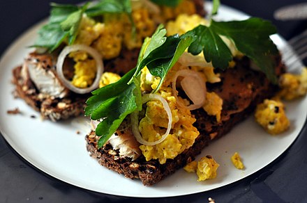 "Smørrebrød". Danish open sandwiches are usually made with dark rye bread, but comes with a large variety of suitable toppings
