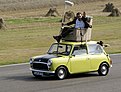 Rowan Atkinson on a Mini at Goodwood Circuit in 2009 (cropped)19.jpg