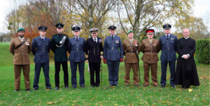 Old Suttonians, including serving officers and Father Jack Noble, at the World War II memorial dedication