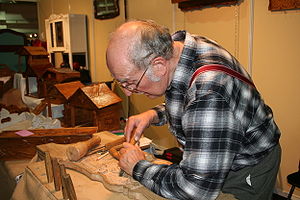 The wood sculptor. Woodcarver.