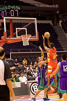 Armein Kirkland (in red) shooting for two points against the Darwin All Stars in the Singapore Challenge in December 2008. Singapore Slingers vs Darwin All-stars.jpg