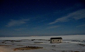 In moonlight, from Green Island Brook, left to right L'Anse Amour light, L'Anse-au-Loup and Capstan Island