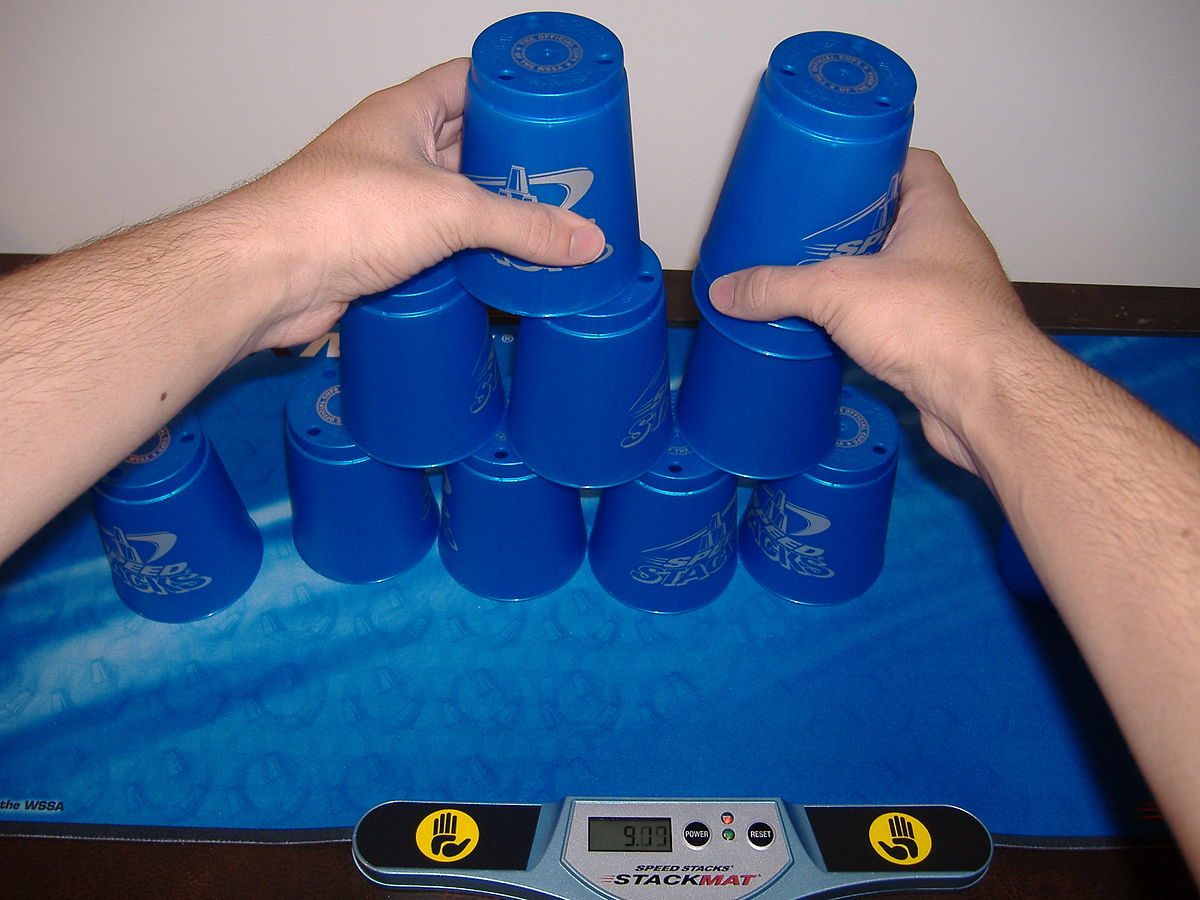 https://upload.wikimedia.org/wikipedia/commons/thumb/2/2e/Sport-Stacking.jpg/1200px-Sport-Stacking.jpg