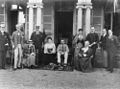 StateLibQld 1 159676 Group of men and women and their dogs on the steps of Government House, George Street, 1897.jpg