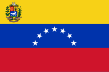 7-star Flag of Venezuela with a coat of arms, in use 1954-2006. Since 2006 it has been used by some of the opposition parties. Flag of Venezuela (1954-2006).svg