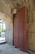 door, photographed from within the gate