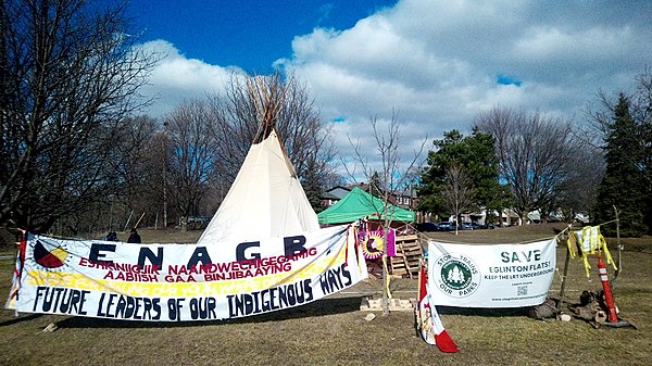 Teepee and protest by a coalition of Indigenous peoples against the decision by Metrolinx to run Line 5 Eglinton aboveground near Jane Street