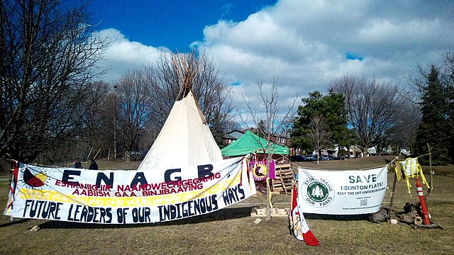 Teepee and protest by a coalition of Indigenous peoples against the decision by Metrolinx to run Line 5 Eglinton aboveground near Jane Street