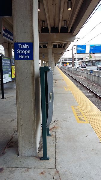 File:Train Stops Here sign, platform, Airport Terminal A station.jpg