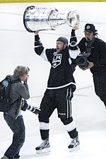 Trevor Lewis hoisting the Stanley Cup, after the Los Angeles Kings won it in 2012. Trevor Lewis (7476675168).jpg