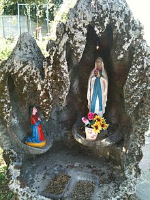 The apparition at Lourdes, represented in a cave