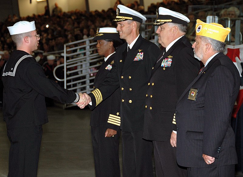 File:US Navy 071018-N-8848T-002 Precommissioning Unit (PCU) George H.W. Bush (CVN 77) Commanding Officer, Capt. Kevin O'Flaherty, congratulates Seaman Recruit Brandon McTaggart, for being named the academic award winner.jpg