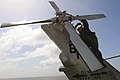 US Navy 091129-N-8772M-075 Aviation Warfare Specialist 1st Class Karl Anderko assigned to the Dragon Whales of Helicopter Sea Combat Squadron (HSC) 28 performs a pre-flight check on the tail rotor.jpg