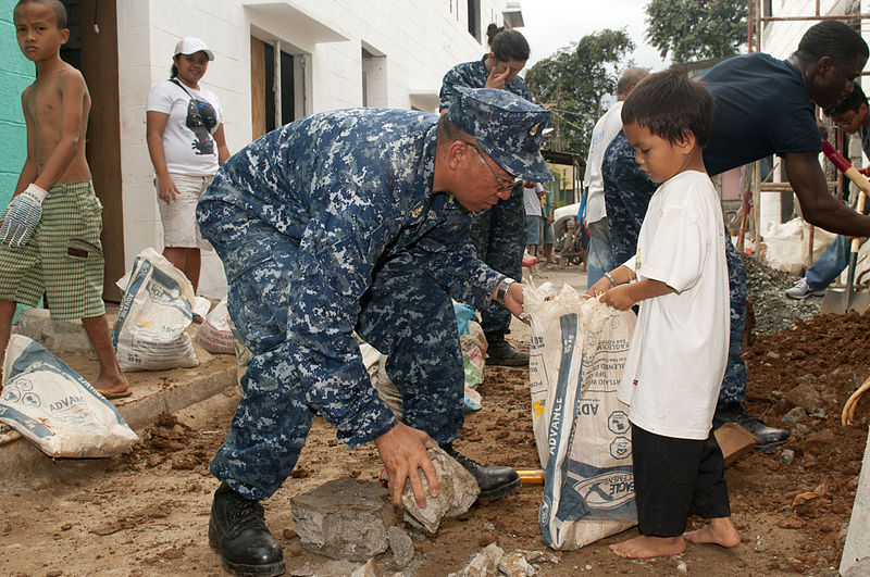 File:US Navy 120201-N-OH194-042 Senior Chief Electrician's Mate Crisanto Flores removes construction debris during a community service project in the vi.jpg
