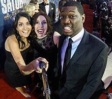 Bayer, with SNL cast mates Cecily Strong (Bayer's left) and Michael Che (right) in 2015 Vanessa Bayer, Michael Che, and Cecily Strong, 2015-02-15 (cropped).jpg