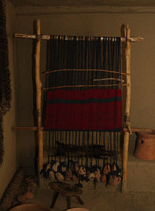 Loom with a shed bar and without a string heddle, neolithic reconstruction in the Piatra Neamt Museum VerticalLoom.JPG