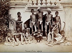 Famine stricken people during the famine of 1876-78 in Bengal WWHooperFamine1876-78GroupOfEmaciaedMenandOneWoman.jpg