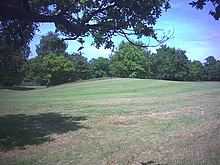 Remains of the ditch between the two main ramparts of the Iron Age hill fort