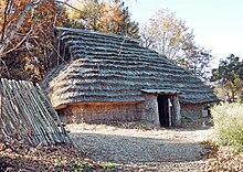 Yaze site reconstructed pit dwelling.jpg