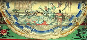 Yue Fei's mother writes jin zhong bao guo on his back, as depicted in a Suzhou style beam decoration at the Summer Palace, Beijing.