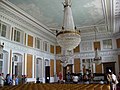 One of the chambers decorated with paintings and chandeliers