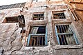 The windows of one of the remaining houses in Qatif Castle, displaying visible cracks and crevices.