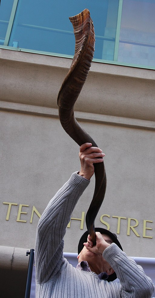 A man blowing a shofar 