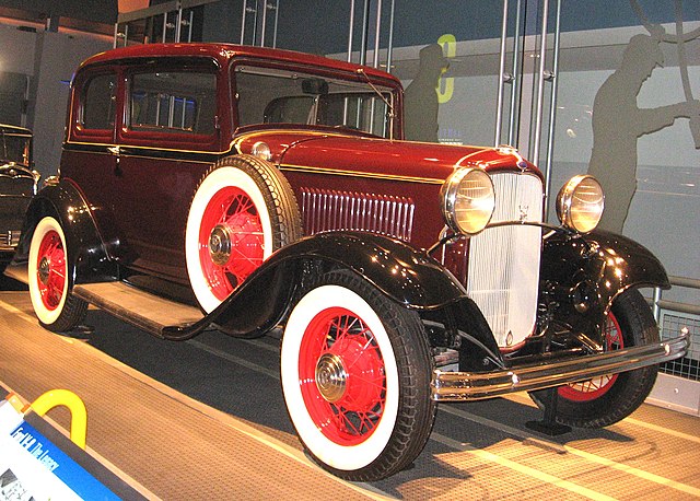 1932 Ford V8 Standard Tudor Model 18 with optional color-keyed wheels, white wall tires, and side mounts