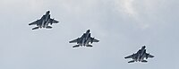 A formation of three F-15C/D Eagles overhead Kadena Air Base in Okinawa, Japan. The aircraft are assigned to the 18th Wing.