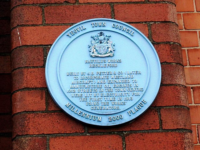 A blue plaque on the Nautilus Works which is now a bus depot