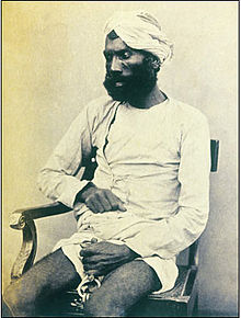 Gungoo Mehter, who was tried at Cawnpore for killing many of the Sati Chaura survivors, including many women and children. He was convicted and hanged at Cawnpore on 8 September 1859. A hand-written caption identifies the man as Gungoo Mehter who was tried at Kanpur for killing many of the Sati Chaura survivors, including many women and children. He was convicted and hanged at Kanpur on 8 September 1859..jpg