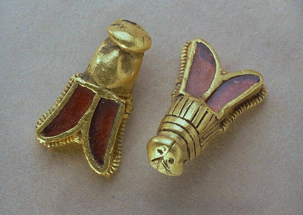 Detail of golden bees with garnet insets