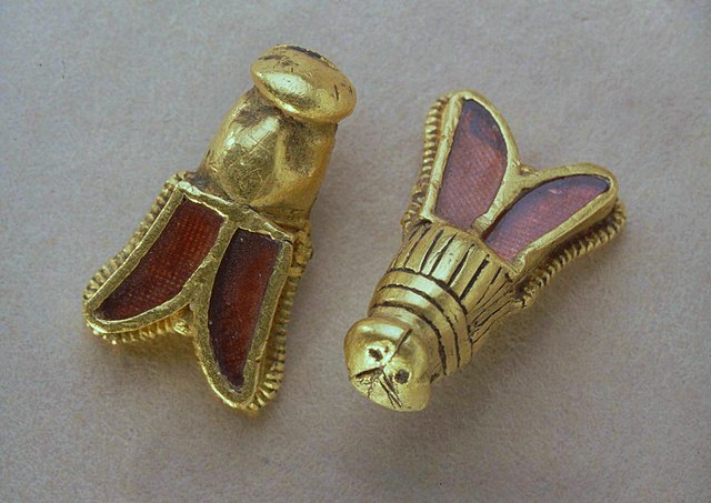 Golden cicadas or bees with garnet inserts, discovered in the tomb of Childeric I (died 482). They may have symbolised eternal life (cicadas) or longe