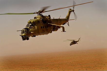Two Mil Mi-35 Hind helicopters during a training sortie over southern Afghanistan, 4 October 2009. U.S. Airmen with the 438th Air Expeditionary Training Group.
