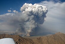 Fire in the Gila River Valley, southwest of Phoenix, (Rainbow Valley over peaks of Sierra Estrella)