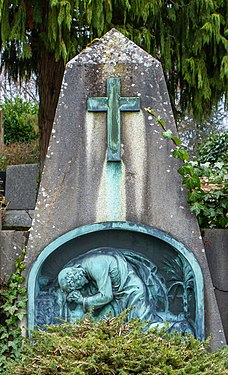 Grave monument: obelisk with bronze relief