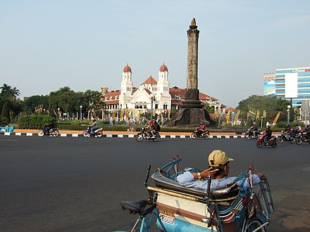 Tugu Muda with Lawang Sewu in the background