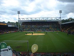 Carrow Road - fans holding yellow or green fliers.jpg