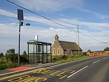 Solar street light at a bus stop Church and bus stop, Llandissiliogogo - geograph.org.uk - 581087.jpg