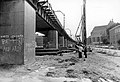 De aanleg van de Willemsspoortunnel met eerste pijler voor het noodviaduct aan de Binnenrotte met op de achtergrond de Sint-Laurenskerk 1988.jpg