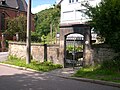 Enclosure wall on the street side with gate system and gate