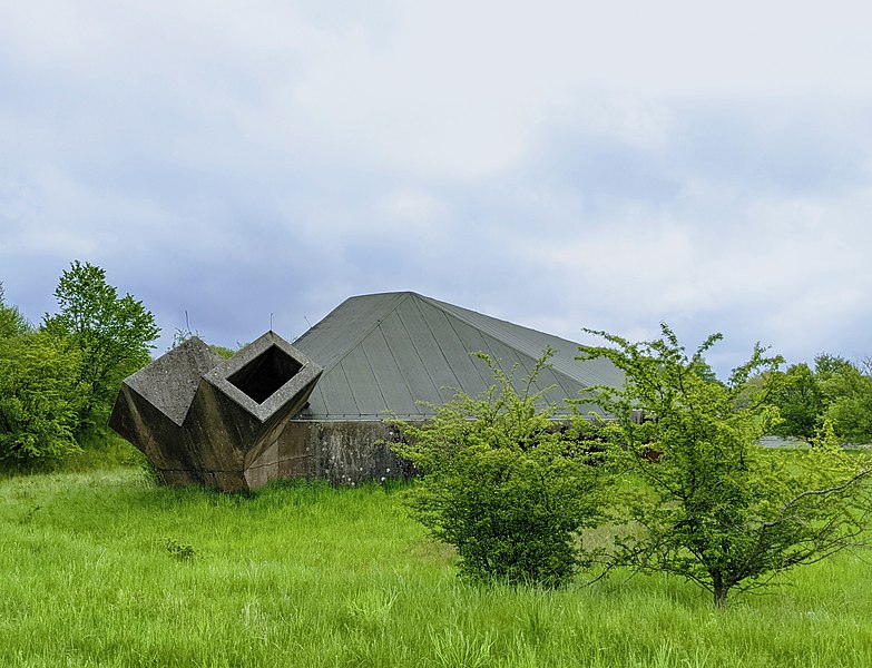 File:F16 reinforced hangar at a disused military airfield (51260718704).jpg