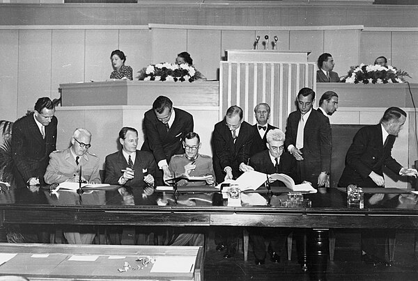 The signing of the Geneva Conventions in 1949. A country's signature, through plenipotentiaries with "full power" to conclude a treaty, is often suffi