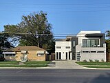 Gentrification with an old and a new home side by side in Old East Dallas.jpg