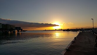 Sunset as seen from the Marina main pier. Gibraltar sunset in the Ocean Village Marina.jpg