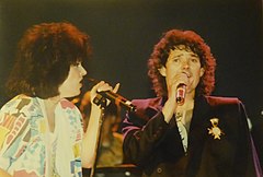 Grace Slick and Mickey Thomas onstage in 1985 Grace and Mickey Onstage '80s (Dave Cackowski).jpg